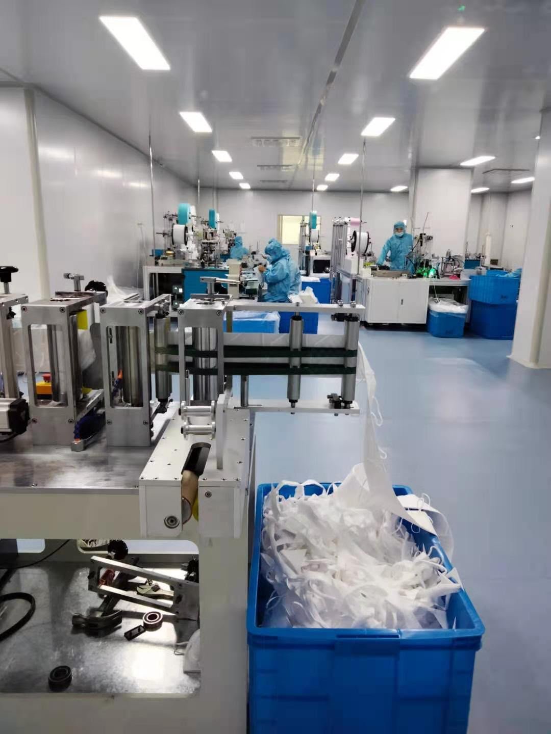 I-TEC staff in cleanroom attire on our Singapore production line